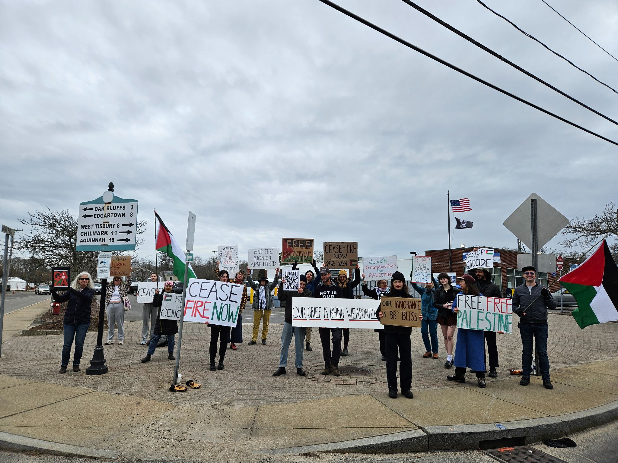 CeasefireMV members standing on the sidewalk holding signs demanding a ceasefire